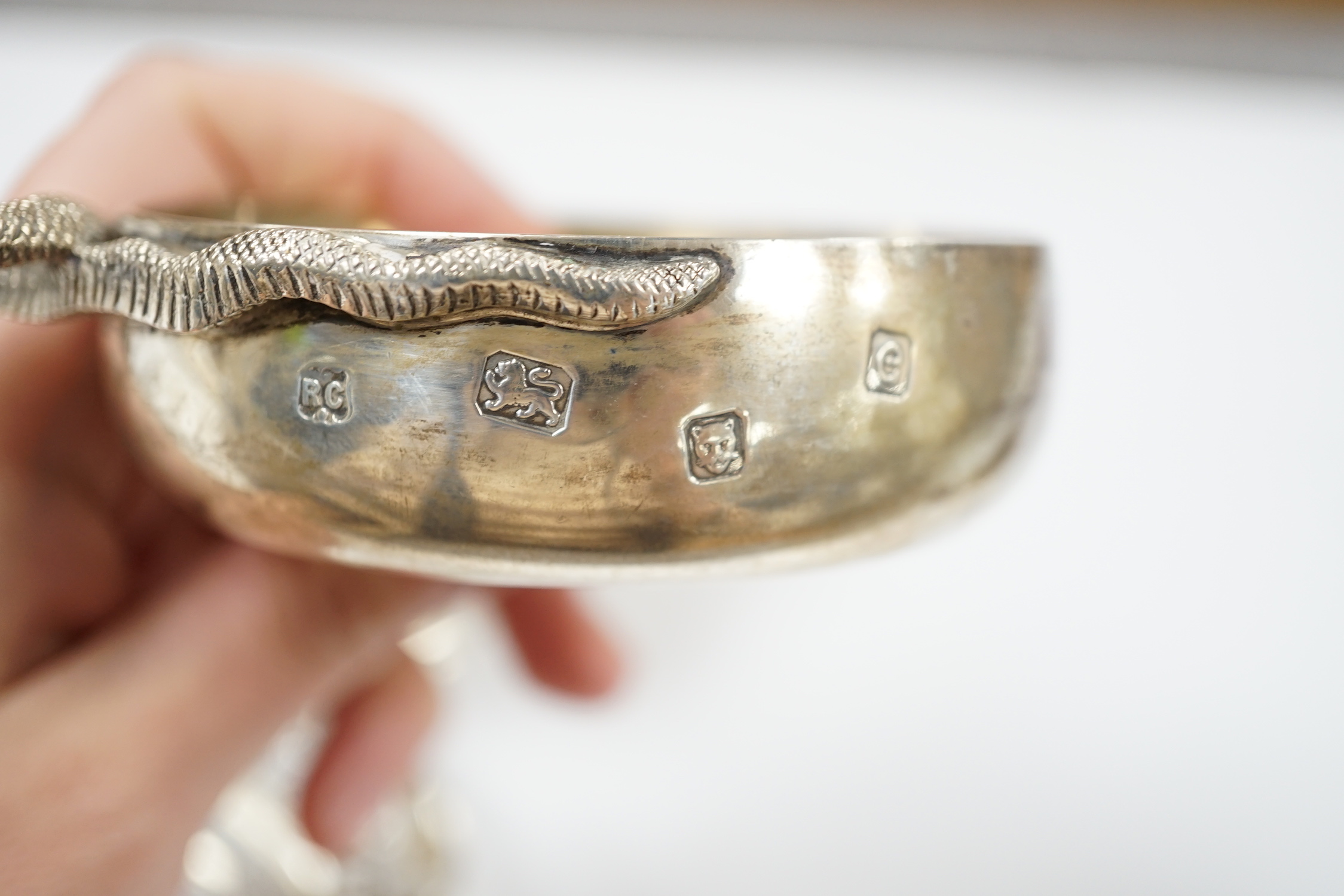 An Edwardian repousse silver porringer, Daniel & John Welby, London, 1905, diameter 92mm, a pair of pierced silver bonbon dishes, one other similar bonbon dish, a silver two handled bowl and a modern silver taste vin